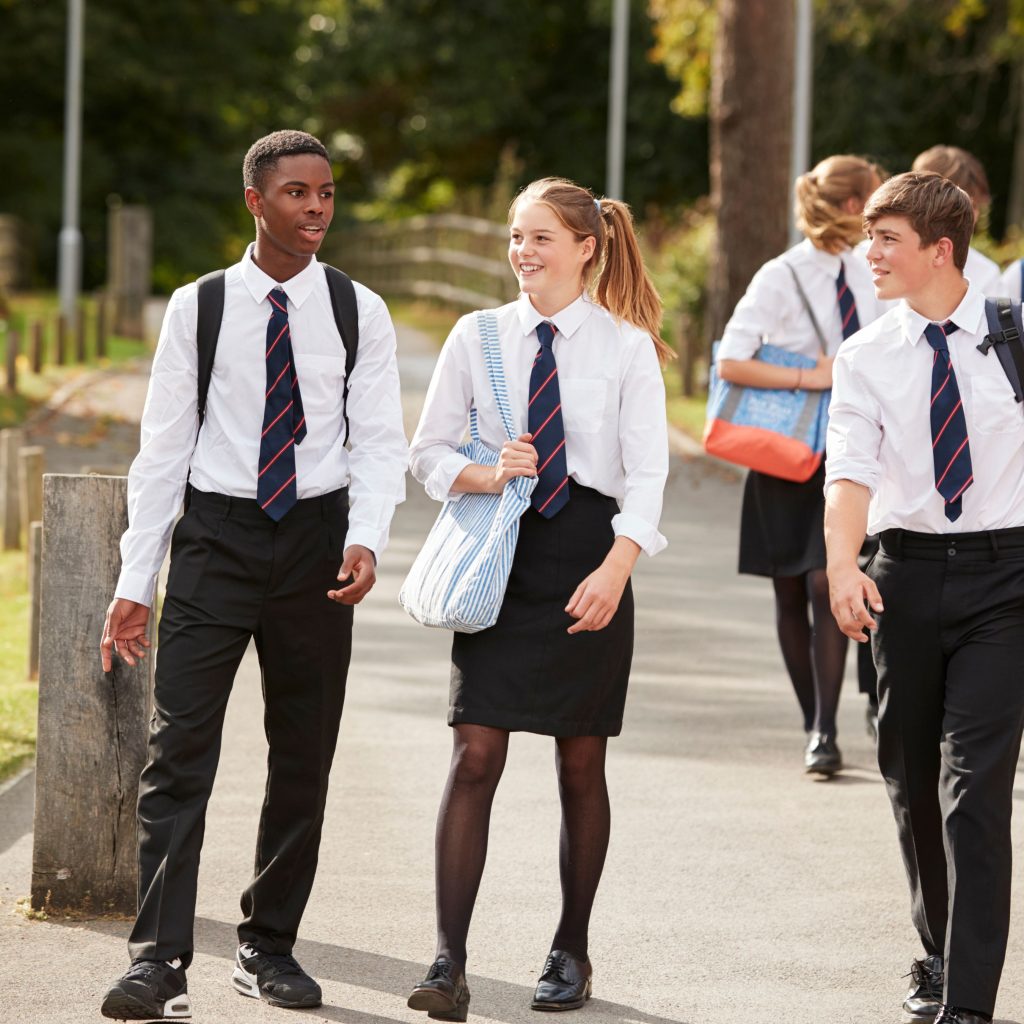 children walking in school uniform